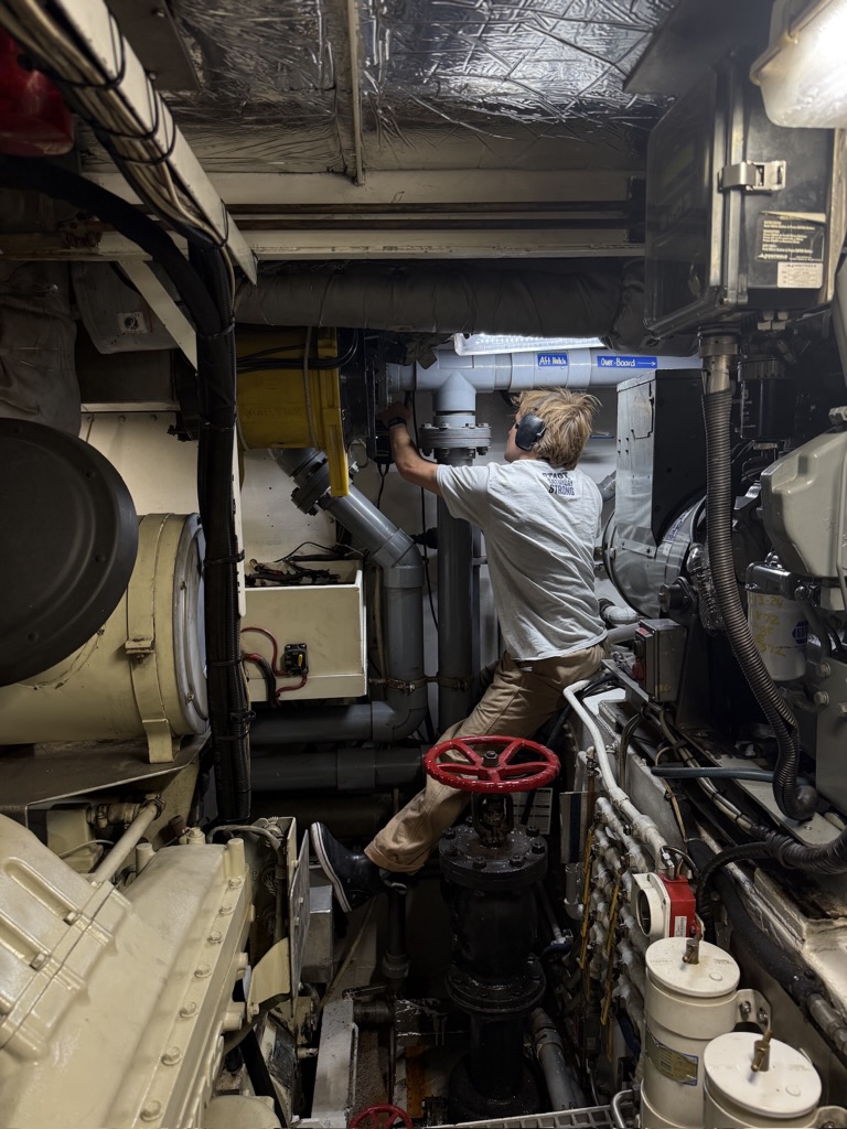 Reaching over the mains to a valve in the engine room