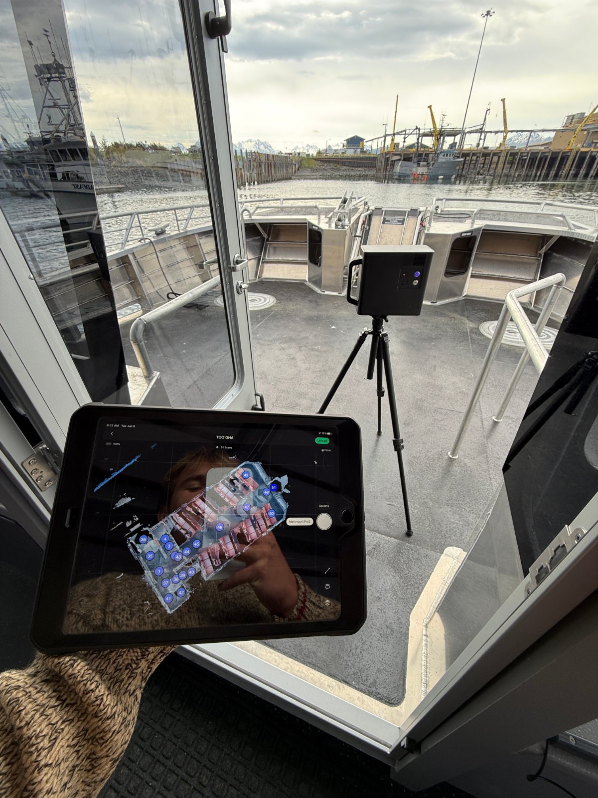Matterport camera on a tripod on the aft deck, the scan in progress on an iPad