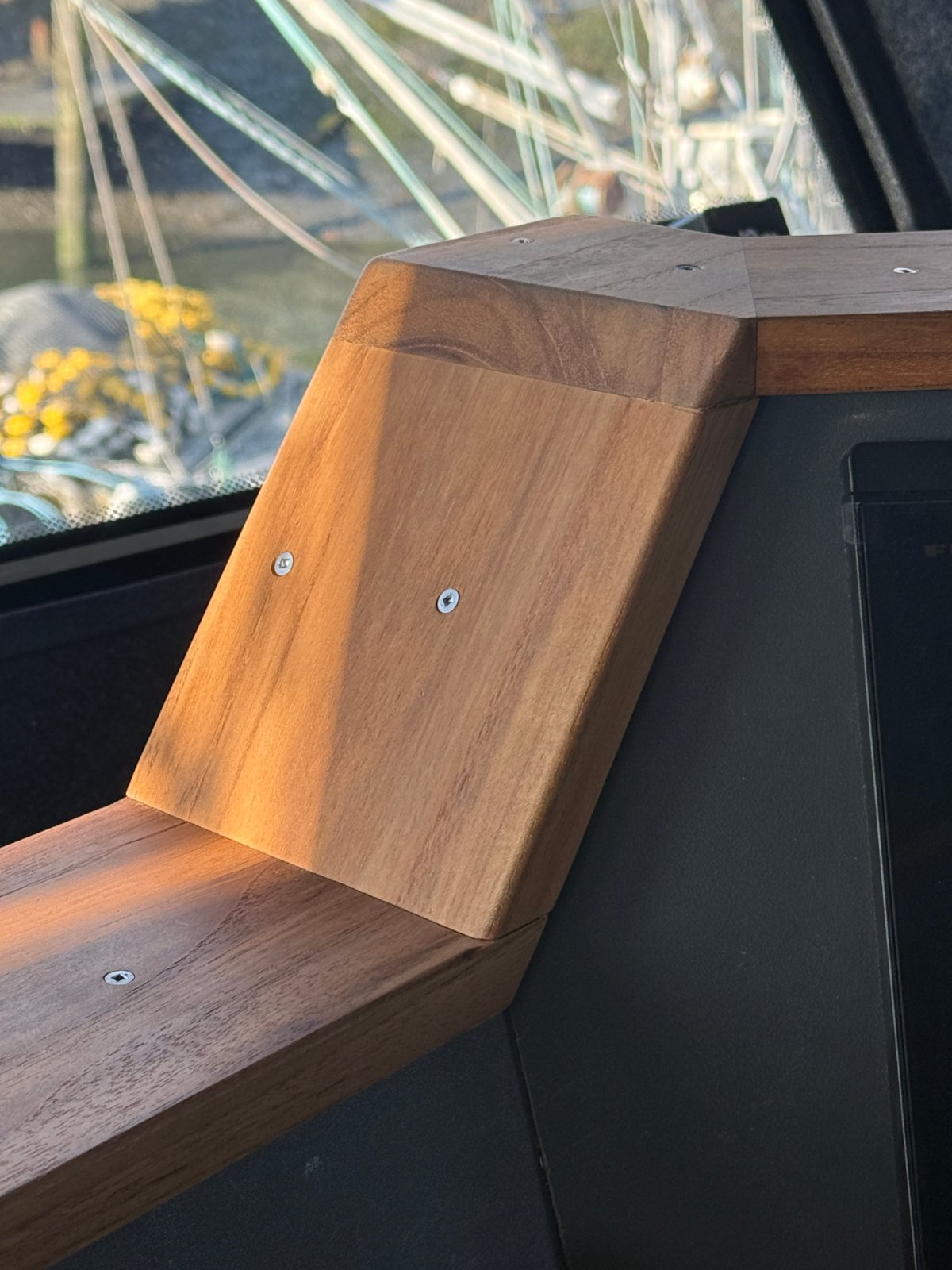 Teak trim cap on the helm console