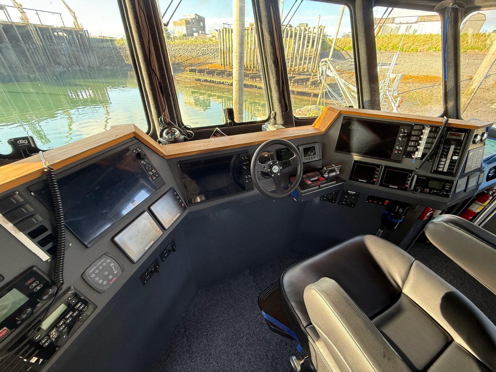 Finished helm with teak trim around the console